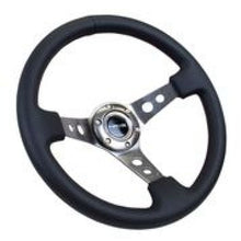 Carica l&#39;immagine nel visualizzatore di Gallery, NRG Reinforced Steering Wheel (350mm / 3in. Deep) Blk Leather w/Gunmetal Circle Cutout Spokes
