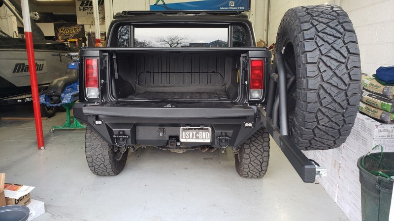 Road Armor 03-09 Hummer H2 Dakar Rear Non-Winch Bumper w/Tire Carrier - Tex Blk