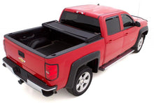 Laden Sie das Bild in den Galerie-Viewer, Lund 02-17 Dodge Ram 1500 (5.5ft. Bed) Genesis Elite Tri-Fold Tonneau Cover - Black